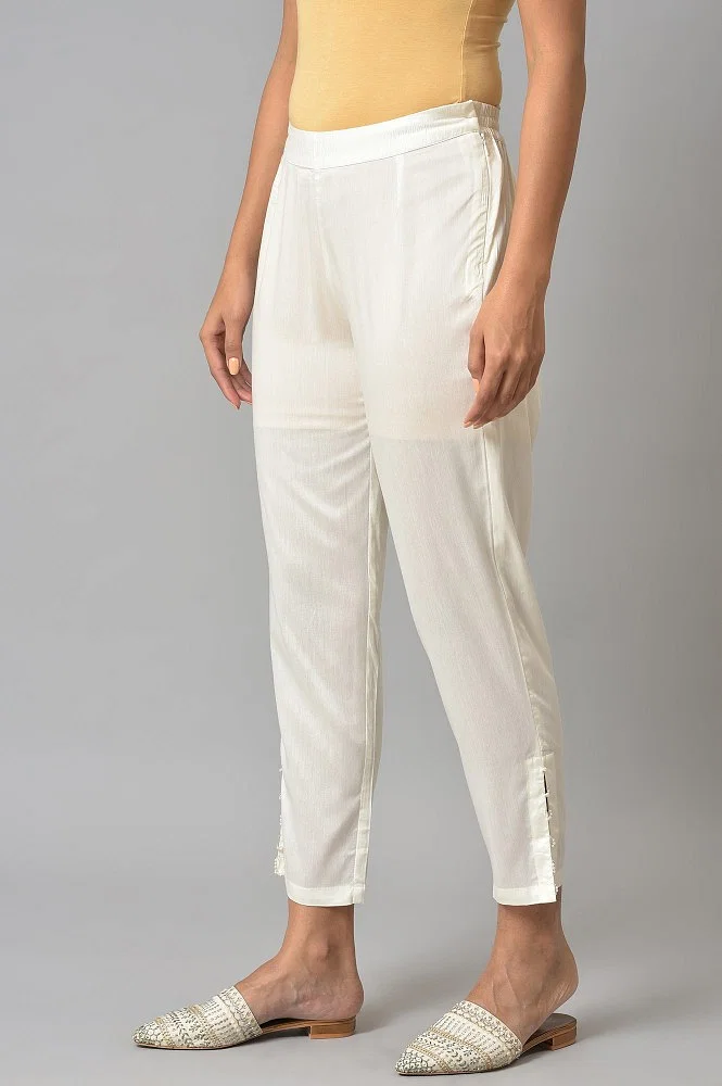 Buy Ecru Solid Light Festive Slim Pants Online - Shop for W
