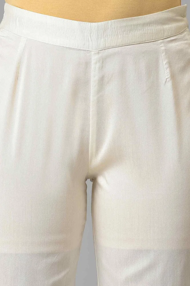 Buy Ecru Solid Light Festive Slim Pants Online - Shop for W
